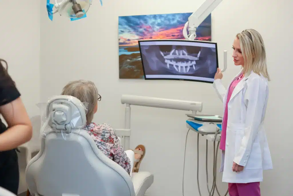 Amarillo dentist talking to a patient about her new dental implants