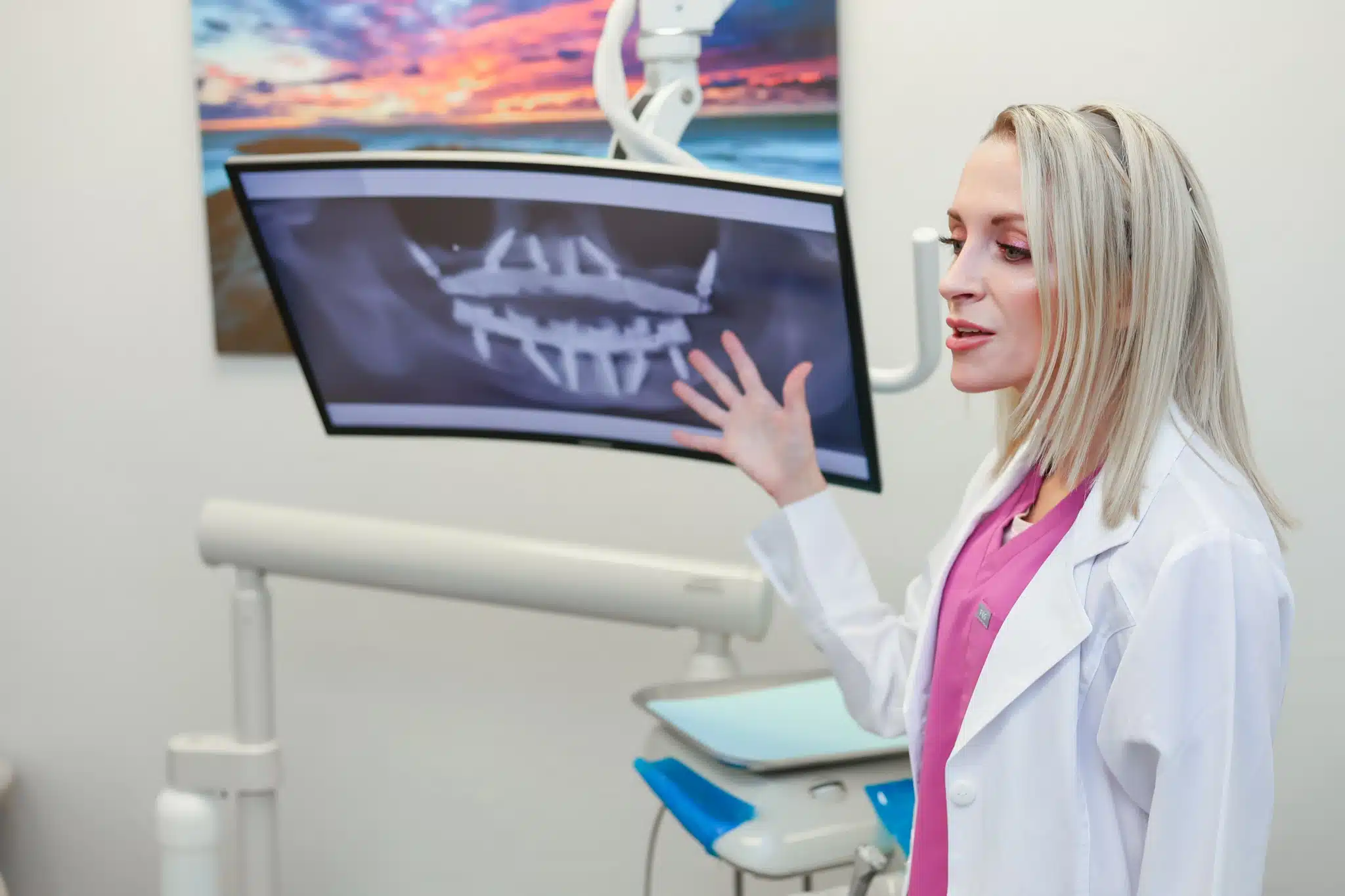 A dentist in Amarillo discussing implant supported bridges with a patient