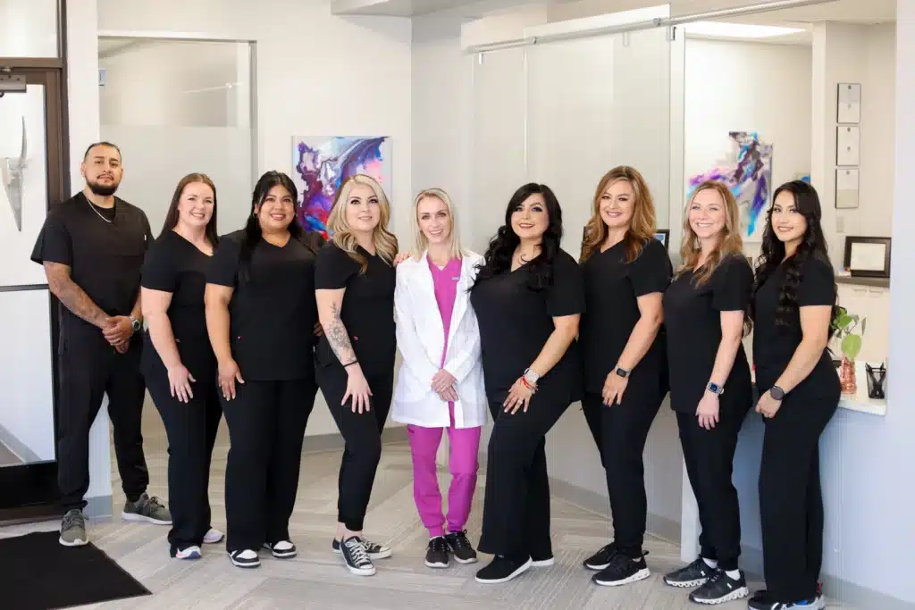Amarillo dental team of Texas Implant and Dental Centre smiling for a picture